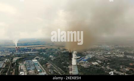CHERKASY, UKRAINE, SEPTEMBER 12, 2018: Big Power plant , factory with pipes, expelling smoke into sky. Smoke from industrial chimney. ecology, pollution of the environment. High quality photo Stock Photo