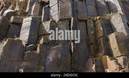 Background from natural material of basalt stones Stock Photo