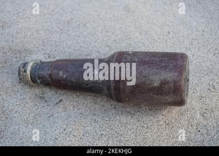 bottle isolated on sand Stock Photo