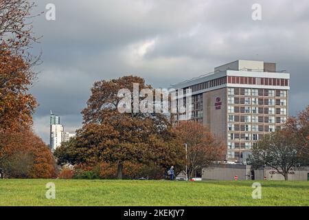 The Crowne Plaza Hotel on Armada Way between Plymouth city centre and the historic Hoe. Seen from Hoe Park with a forground of golden autumn trees and Stock Photo