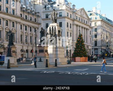 The Guards Crimean War Memorial in Waterloo Place, London, flanked by bronze statues of Florence Nightingale and Sydney Herbert (English statesman) Stock Photo