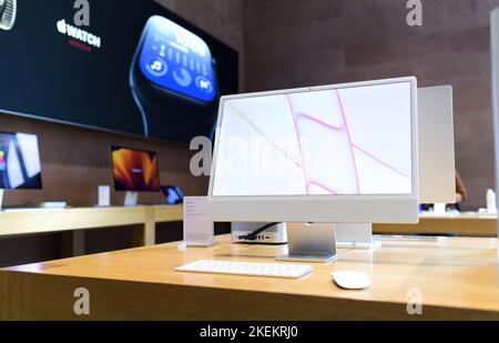 Paris, France - Oct 28, 2022: Hero object for the new Apple Computers iMac all in one computer with advertising for Apple Watch series 8 in the background Stock Photo