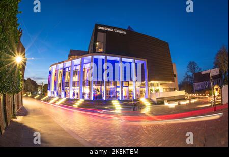 The Marlowe Theatre, a modern theatre illuminated on a performance evening. Canterbury, Kent Stock Photo