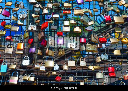 Cologne, Germany - May 29, 2011: lockers at the  Hohenzollern bridge symbolize love for ever in Cologne, Germany. It is the most heavily used railway