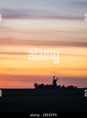 Silhouette of a traditional windmill in the English countryside at sunset. Ripple, Kent Stock Photo
