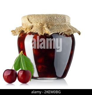 cherry jam in glass jar with burlap on the lid isolated on white Stock Photo