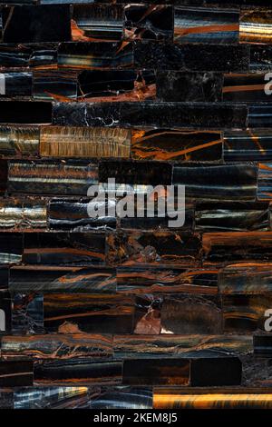 Tiger Eye Blue slab. Polished semiprecious natural dark stone for ceramic wall and floor digital tiles. Exclusive luxury gemstone background, texture Stock Photo