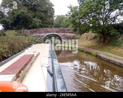View from a Narrowboat, approaching a bridge on the Shropshire Union canal near Market Drayton Stock Photo
