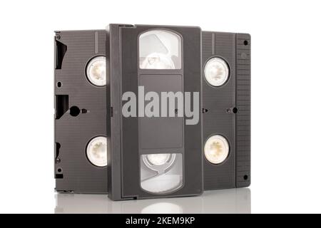 Three video cassettes, macro, isolated on white background. Stock Photo