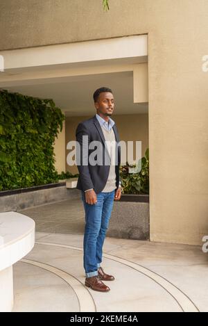 Portrait of handsome black African businessman wearing suit Stock Photo