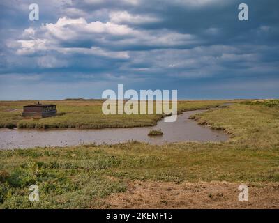 The North Norfolk coastal wetlands, in the east of the UK. Taken on a calm, sunny day in summer with a blue sky. Stock Photo