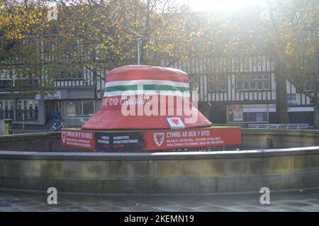 13th November 2022, Swansea, Wales, United Kingdom. A large bucket hat displayed in Swansea's Castle Gardens to support Wales in the 2022 World Cup. Stock Photo