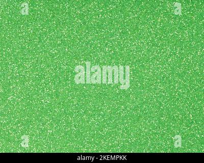 Festive soft green holographic glitter. Bright glowing green background for St.Patrick's Day, Christmas, New Year, xmas gift card or other holiday Stock Photo