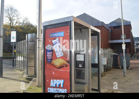 13th November 2022, Swansea, Wales, United Kingdom. A BT Phone box advertising Greggs Christmas products. Stock Photo