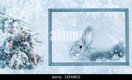 A rabbit outside the frame next to a snow-covered Christmas tree. Chinese New Year. The year of the rabbit. Copy space Stock Photo