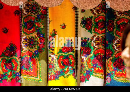 A closeup of vibrant colored hand painted kerchief texture background Stock Photo