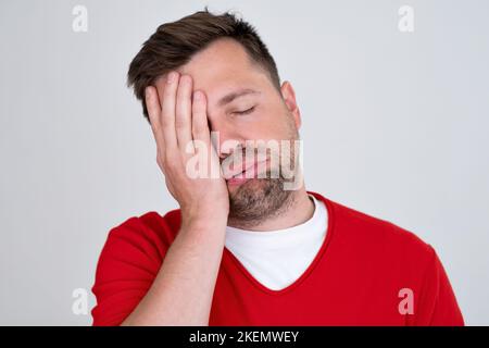 confused man overthinking suffering from grief frustration pain with sick face.  Stock Photo