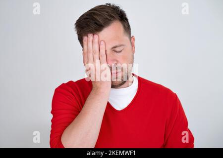 confused man overthinking suffering from grief frustration pain with sick face.  Stock Photo