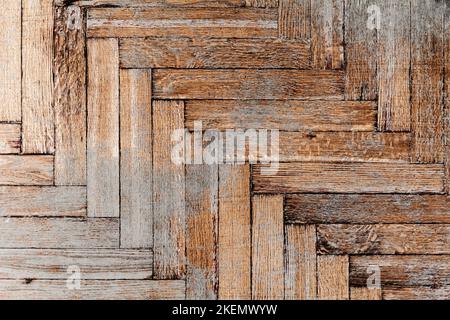 Old weathered parquet made of rectangular wooden planks, top view. Background photo texture Stock Photo