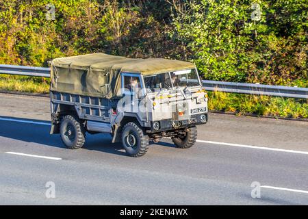 1977 70s seventies Land Rover A4 101 FORWARD CONTROL, 101FC a vintage light utility vehicle produced by Land Rover for the British Army. An unusual V8-powered four-wheel drive army transport vehlcle travelling on the M6 motorway UK Stock Photo