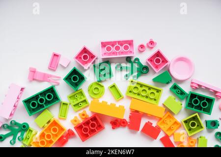 Multicolored plastic building blocks of the designer. Educational developing toys background.copz space Stock Photo