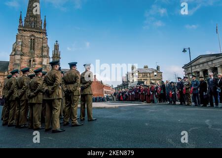 Hereford, UK. 13th Nov, 2022. Members of the Armed Forces pay their respects. Hereford marks Remembrance Sunday on the 100th anniversary of the Eleanor Cross in St Peters Square. Designed in the form of an Eleanor Cross, the 30ft high Memorial was unveiled and dedicated on 7th October, 1922 in commemoration of about 2000 Herefordshire service men and women who gave their lives in the 1914-1918 War. Credit: SOPA Images Limited/Alamy Live News Stock Photo