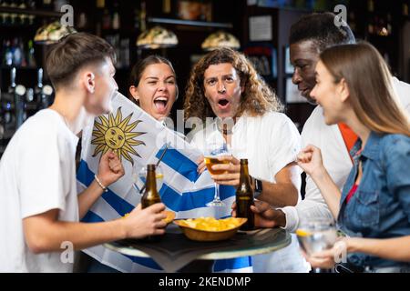Uruguay football team fans spending time in bar Stock Photo - Alamy