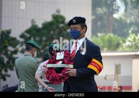 Hong Kong, China. 13th Nov, 2022. A man holds a wreath during the remembrance day. Hundreds of people gathered in front of the Cenotaph in Central to commemorate those who lost their lives during the two world wars. (Photo by Nora Leung/SOPA Images/Sipa USA) Credit: Sipa USA/Alamy Live News Stock Photo