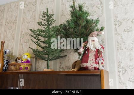 Vintage Santa Claus toy stands on a shelf Stock Photo