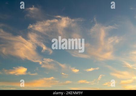 Dramatic colorful red orange to dark blue sunset or sunrise sky landscape clouds. Natural beautiful cloudscape dawn background wallpaper. Stormy windy Stock Photo