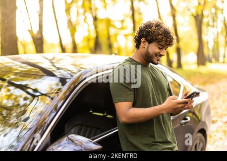 Free Photo | Portrait young handsome man posed standing with car