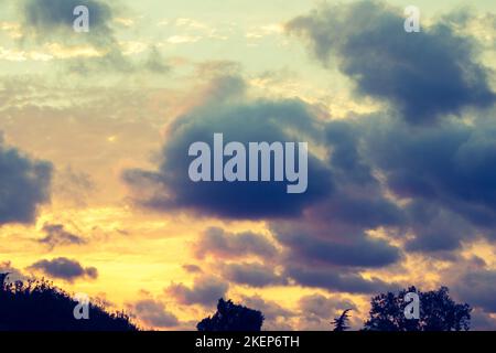 Grey color clouds partly cover the sky in the daytime Stock Photo - Alamy