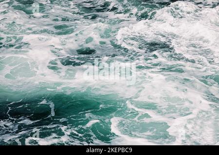 Ocean waves close-up, turquoise water and foam texture, abstract background Stock Photo