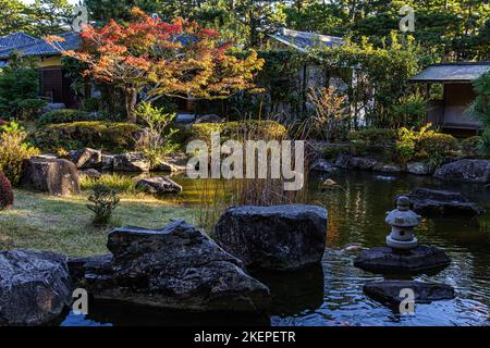 Shiosai Teien is a traditional chisen kaiyu shiki Japanese strolling pond garden with teahouses overlooking the pond. Within the grounds, called Shios Stock Photo