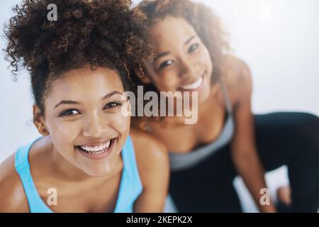 Thing are looking up. High angle portrait of two young women after yoga class. Stock Photo