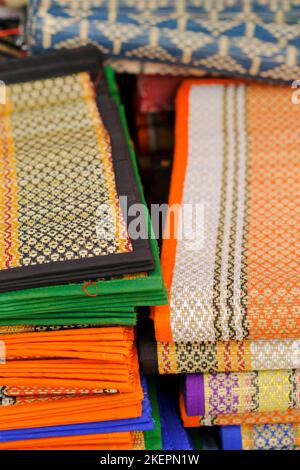 Jute knitted fabric, Handmade Carpet, jute and crochet hooks, background, texture. Stock Photo