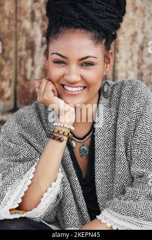 Style, because personality isnt the only thing people see. an attractive young woman posing outdoors. Stock Photo