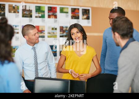 Getting down to business. a group of businesspeople working in the office. Stock Photo