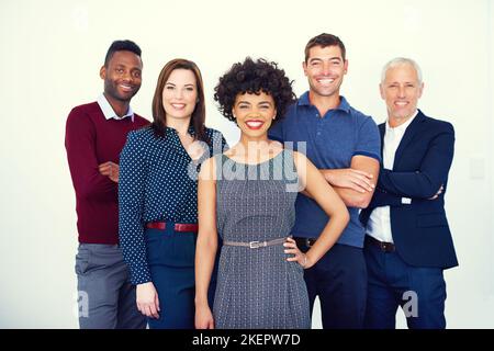 Were the team you need. Cropped portrait of a group of businesspeople standing in the studio. Stock Photo