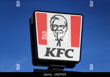 File photo dated 24/03/20 of a view of the sign at a KFC restaurant and drive-thru in Skegness, Lincolnshire. Fast-food chain KFC has pledged that a third of all its new staff by 2030 will be young people who have faced barriers to employment. Issue date: Monday November 14, 2022. Stock Photo