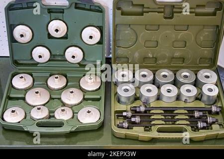 A set oil filter wrench sockets of various sizes. Exhibition of professional tools for work, repair and construction Mitex - Moscow, Russia, November Stock Photo