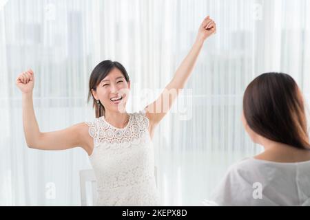 A portrait of happy excited young Asian man isolated on white ...