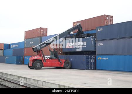 Jakarta/Hong Kong. 14th Nov, 2022. A staff member loads a cargo container of China Railway Express to a train in Malaszewicze, Poland, Oct. 15, 2021. Credit: Zhou Nan/Xinhua/Alamy Live News Stock Photo