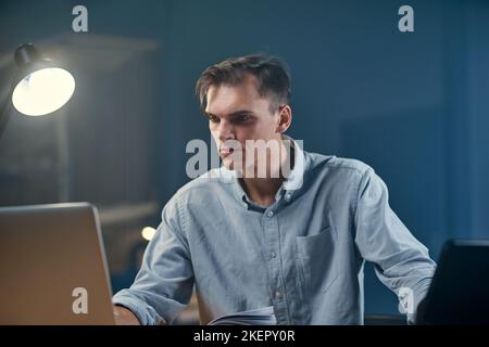 young businessman writing down his ideas in a notebook. Stock Photo