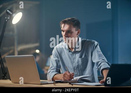 young businessman using a laptop while working on a new project . Stock Photo