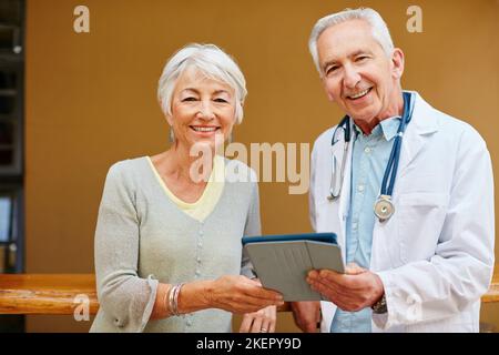 Hes been my trusted doctor for years. Portrait of a senior woman visiting her doctor. Stock Photo