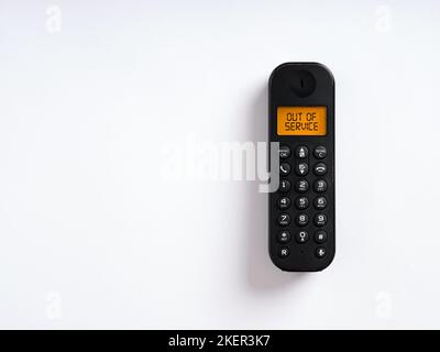 The message out of service written on the screen of a wireless phone. Unreachable customer support concept. Stock Photo