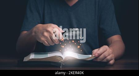 Man reading and search Holy Bible teaching spiritual word book with faith in religion and belief in god. Power of hope and devotion. Stock Photo