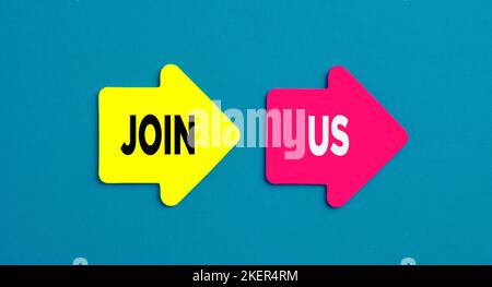 Arrow shaped stickers with the message join us on blue background. Stock Photo