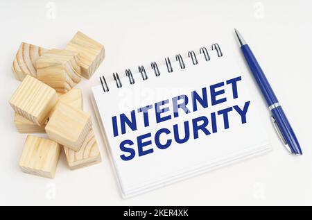 Internet and security concept. On the table are cubes, a pen and a notebook with the inscription - internet security Stock Photo
